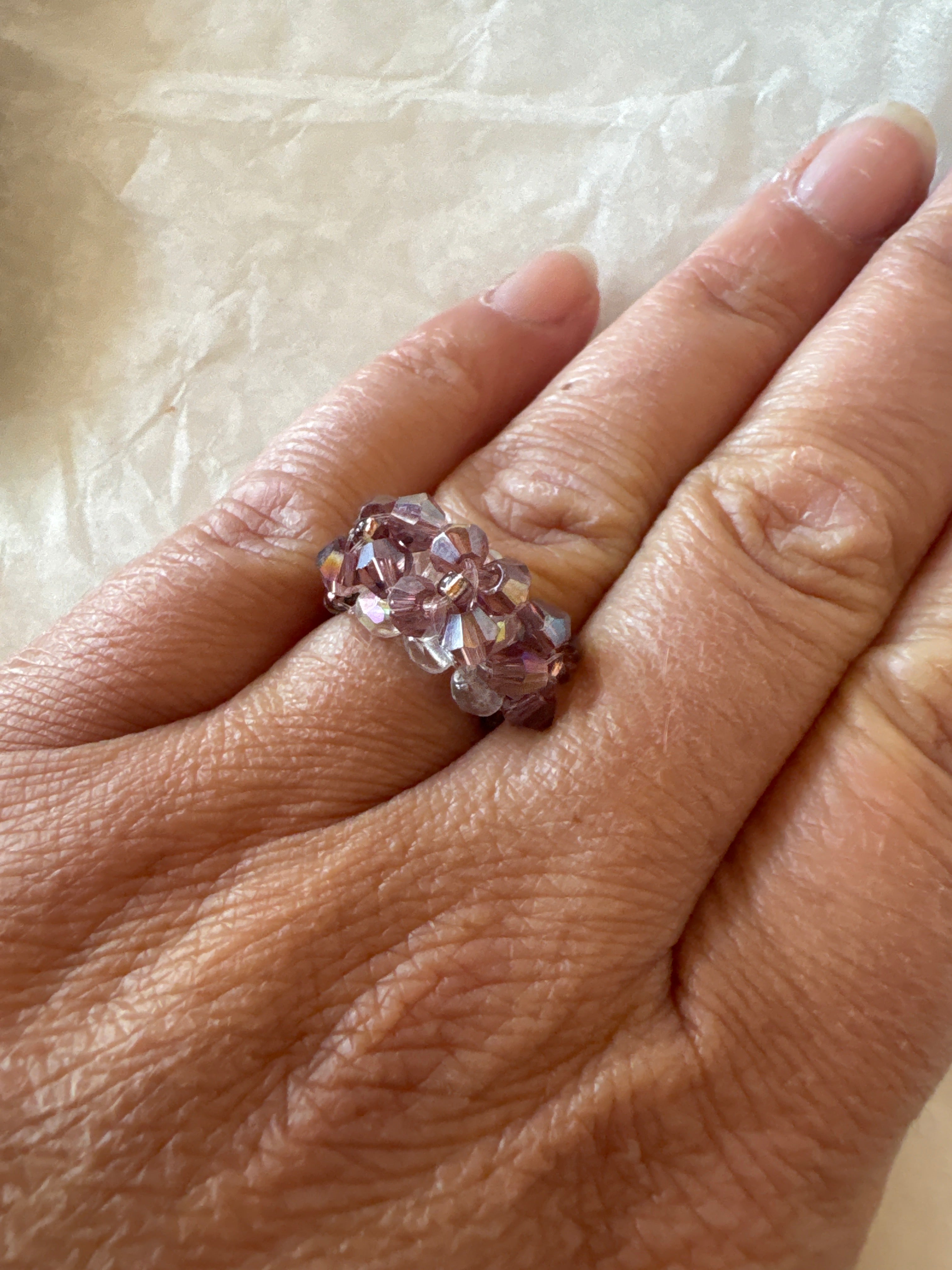 Bague fleurs swarovski ton violet métallisé transparent
